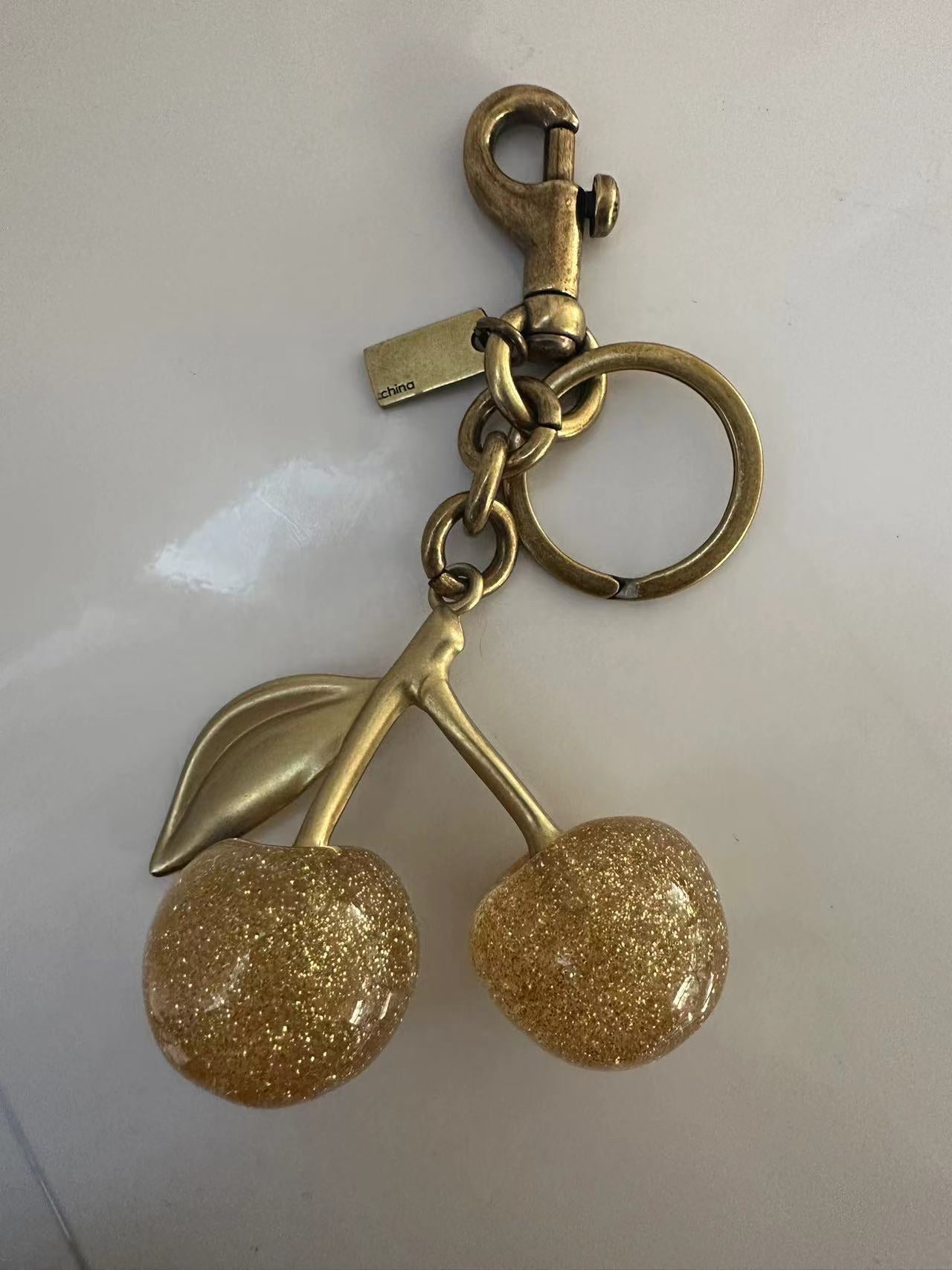 Goldener Kirsch - Schlüsselanhänger mit Glitzer - Nach - Dir.de