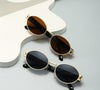 Runde Retro - Sonnenbrille in Schwarz - Nach - Dir.de
